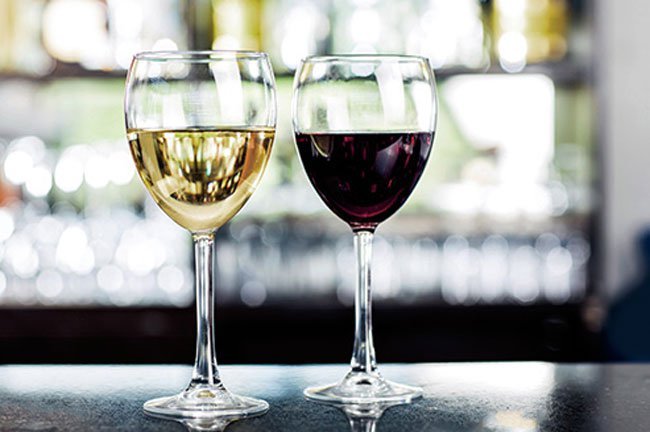 The difference between white wine and red wine is that white wine is fermented without the skins, and red wine is fermented with them.