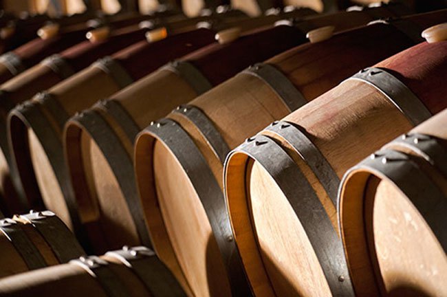 Aging wine in oak barrels slowly adds oxygen to the wine and pleasant flavors from the wood.