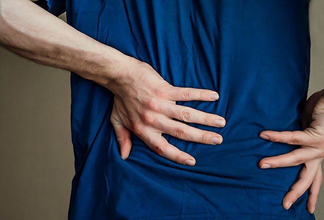 Middle back pain is a common complaint in middle-aged individuals who sit for long hours at work.