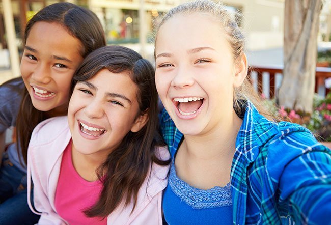 A 12-year-old girl is not a teenager yet not exactly a child anymore. Normal behavior for a 12-year-old girl may include mood swings, increasing technological savvy, development of new interests and other changes.