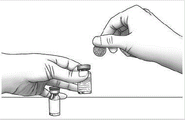 Using your thumb, flip the plastic cap
off of the Zorbtive<sup>®</sup> and diluent vial. - Illustration